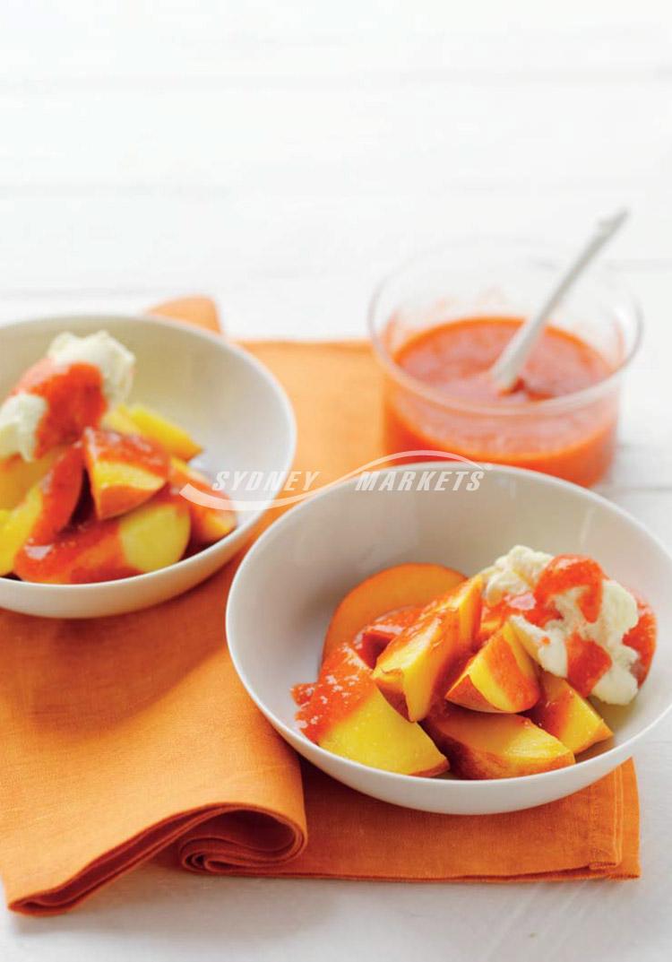 Peaches with strawberry sauce