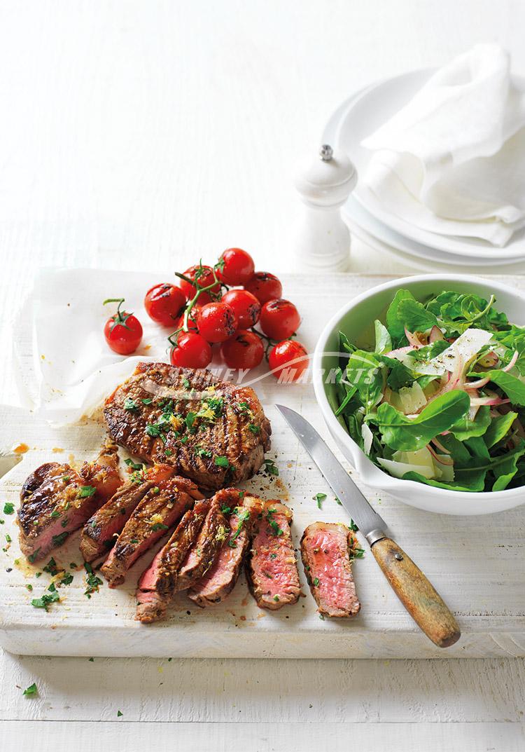 Rocket & red onion salad with BBQ steaks