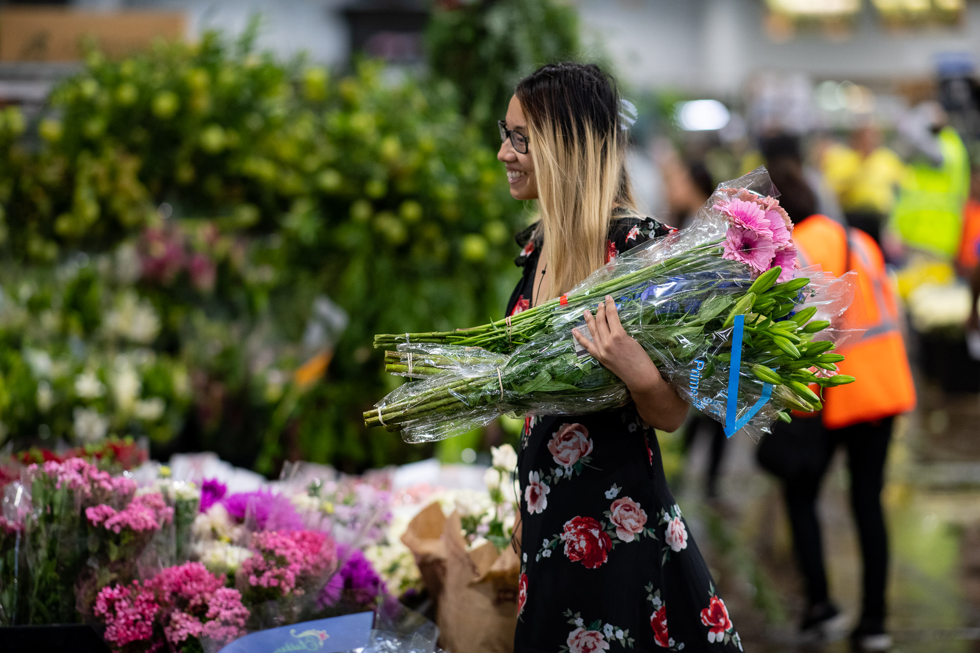 Customer carrying fresh flowers at Sydney Flower Market